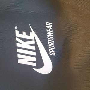 Green and white Nike sportswear pants